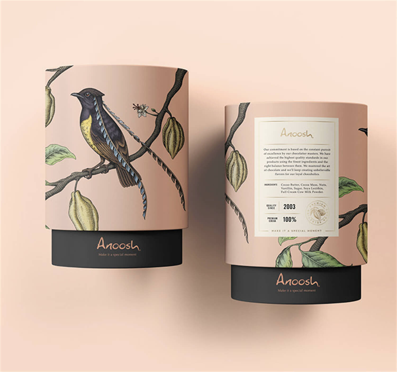 Two cylindrical paper tubes with detailed illustrations of a black bird perched on a branch with green leaves, set against a soft peach background.