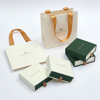 Custom rigid drawer boxes and paper bags