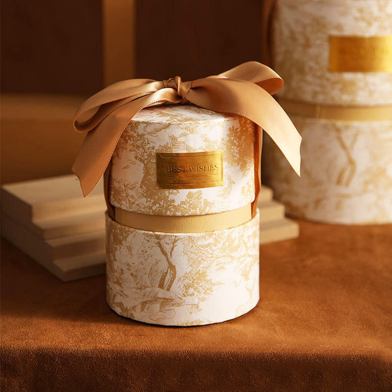 A luxurious paper candle tubes with a ribbon bow  