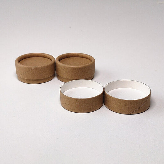 Open brown paper tubes with two stacked on the left and two side by side on the right, on a light grey background.