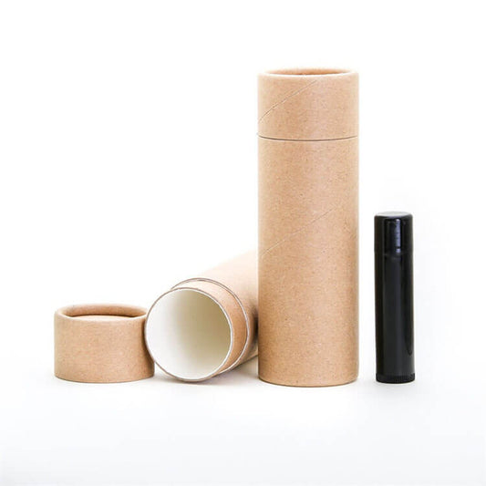 Brown paper tubes and one black tube, standing and lying horizontally, against a white backdrop.